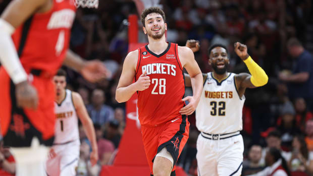 Apr 4, 2023; Houston, Texas, USA; Houston Rockets center Alperen Sengun (28) and Denver Nuggets forward Jeff Green (32) react after a play during the third quarter at Toyota Center. Mandatory Credit: Troy Taormina-USA TODAY Sports